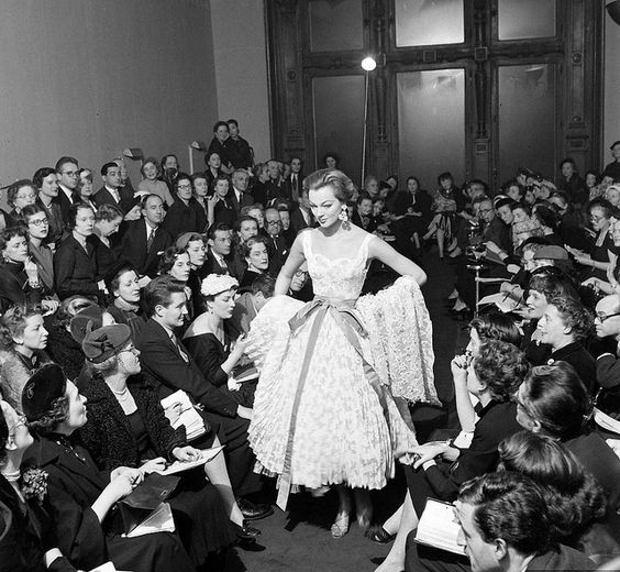 Ivy Nicholson 1952 Modeling Givenchy's pleated lace evening dress in his debut showing before a crowd of fashion editors.