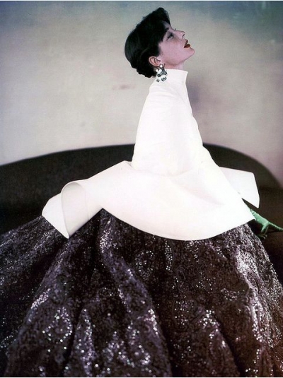 Bettina in glittering evening gown worn with white capelet by Givenchy, photo by Milton Greene, 1952