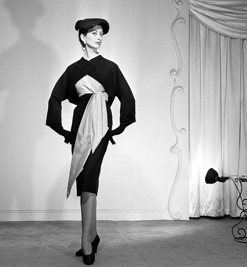 Della Oake in dress and jacket attributed to Givenchy (?), Spring/Summer 1952, photo by Walter Carone, Paris, February 1952