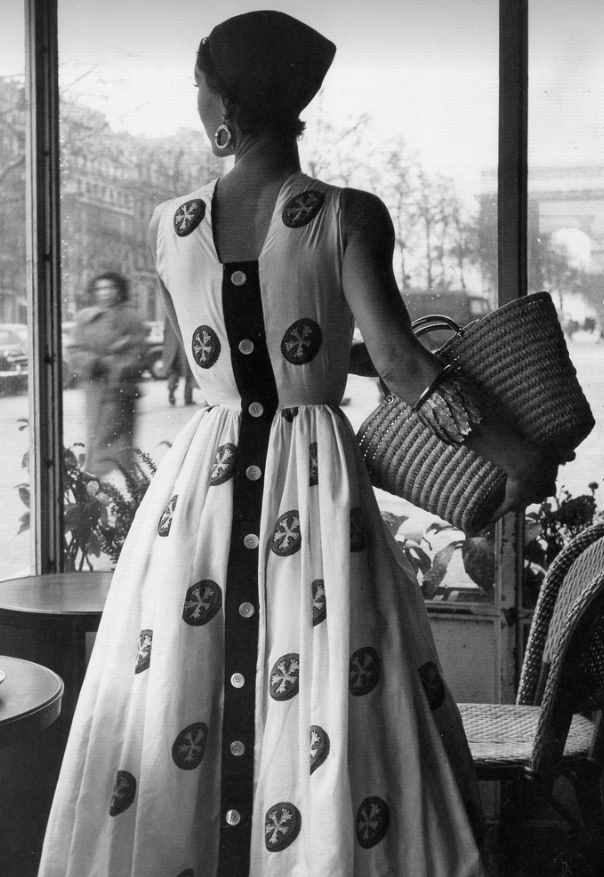 Model in cotton dress embroidered with tomato motifs from Givenchy's Spring/Summer collection 1952.