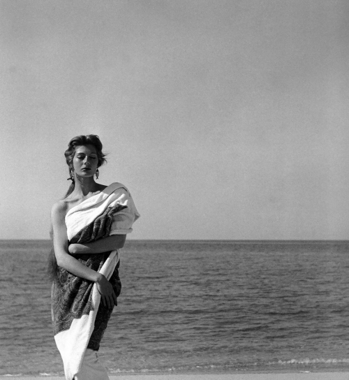 Fiona Campbell-Walter in Hubert de Givenchy Beach Towel, photographed by Georges Dambier for Femina, 1954 June 1954Fiona Campbell-Walter draped in cashmere beach towel by Givenchy, Corsica, photo by
