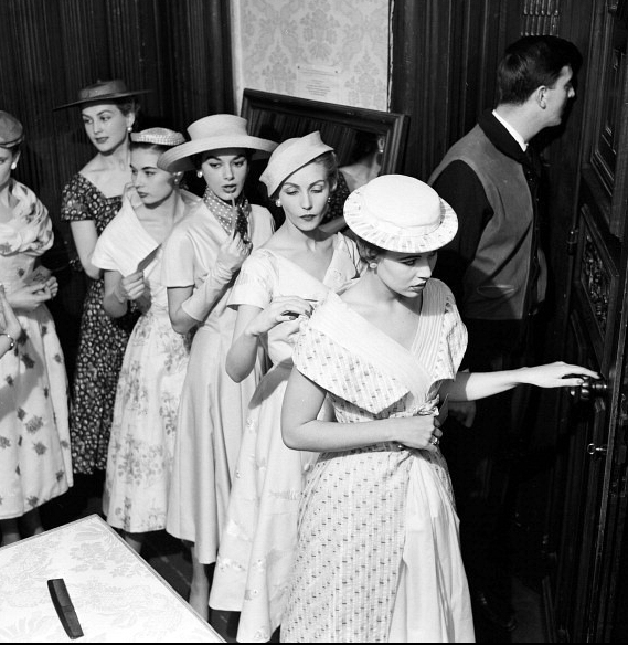 Models wait in line for the signal from Givenchy to present his Spring/Summer collection of 1954, photo by Walter Carone, Feb. 1954 Models are l to r: Beryl, Zoe, Jackie Mazel, Denise Sarrault and Pat.